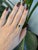 A 0.95ct zambian emerald emerald cut ring set in solid 14K yellow gold, set with twenty-six earth mined diamonds. Emerald,...