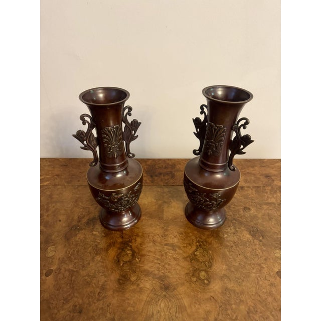 Quality pair of antique Japanese twin handle bronze vases having a quality pair of Japanese bronze vases decorated with...
