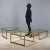 Three nesting tables with brass frames and square tops of varying sizes. In good overall condition with some signs of...