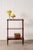 Elegant Victorian mahogany three-tier whatnot featuring turned bobbin legs, rolling casters, and warm aged patina