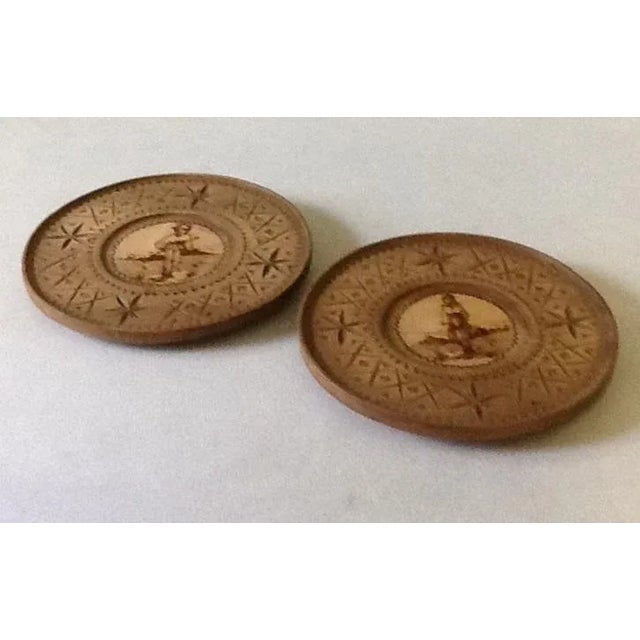 Give your guests a warm welcome with the authentic Old World charm of these matching folk art wall plates handmade by...