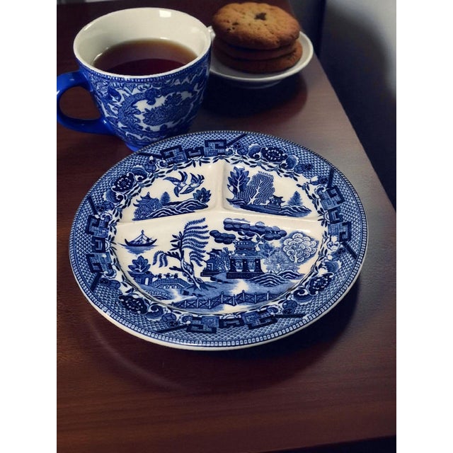 The Vintage Japanese Willow Divided Blue & White Plate is a charming and collectible piece showcasing traditional Japanese...