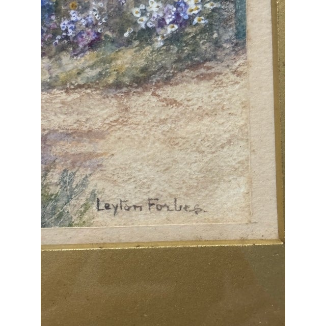 An original framed watercolor by English artist Leyton Forbes, entitled “A Devon Cottage.” The work is rendered in a...