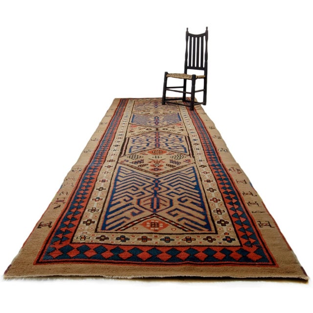 An antique Serab rug runner, Persia, late 19th century. Red and blue on natural, undied camel hair. Unique geometric...