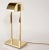 George Kovacs demilune brass lamp. Shade rotates 180 degrees to direct light onto a surface or the wall. Integrated dimmer...