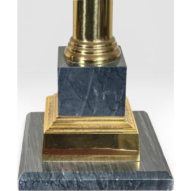 Pair of Vintage Neoclassical Black Brass and Marble Pedestal Table Lamps Attributed to Stiffel This exceptional pair of...