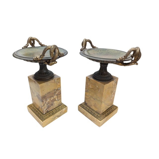 Pair of 19th-Century Bronze Tazzas Featuring Gilt Snake Handles and Siena Marble Stands. Some small chips on the bottom of...