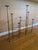 A striking extendable wrought iron candelabra featuring an architectural, sculptural silhouette with varying heights and...