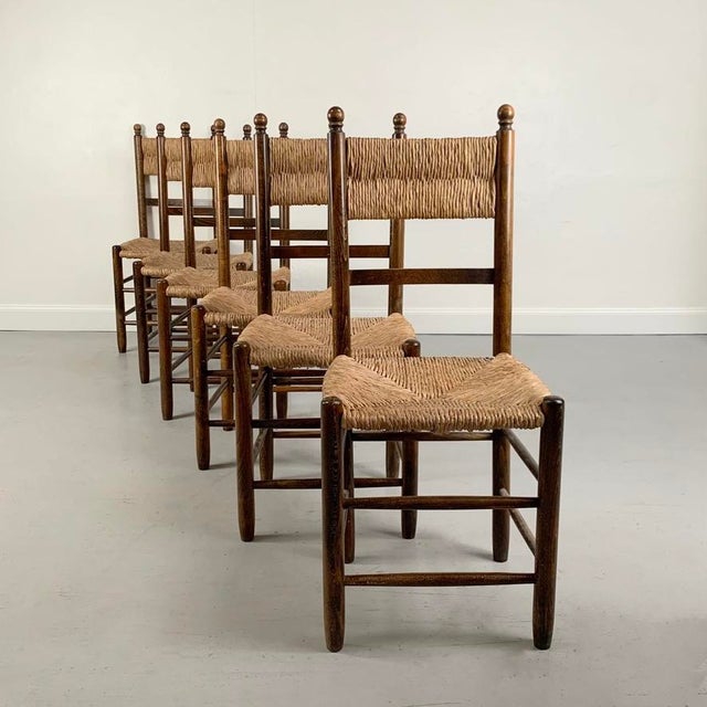Elegant set of six chairs, circa 1960, France. Oak, original straw seat. Dimensions: 98 cm H, 42 cm W, 38 cm D, seat...