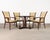 A dramatic set of eight 20th century French Art Deco style dining chairs featuring an exotic Macassar ebony veneered and...