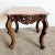 Add a touch of elegance to your home with this Chinese hand-carved rosewood side table. The intricate carvings on the...