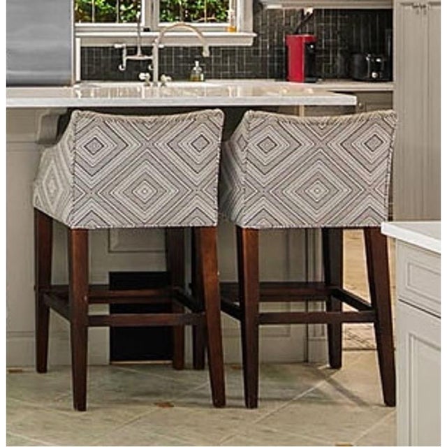 Beautiful set of two upholstered bar- stools featuring a modern gray and white geometric diamond pattern fabric. Dark...