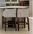 Beautiful set of two upholstered bar- stools featuring a modern gray and white geometric diamond pattern fabric. Dark...