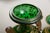 Green glass vase with painted mother and child image and gilt decoration over it's entire surface. Probably, central...