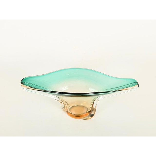 Marvelous mid-century Murano large centerpiece in mouth-blown sommerso Murano glass in a stunning light emeral and amber...