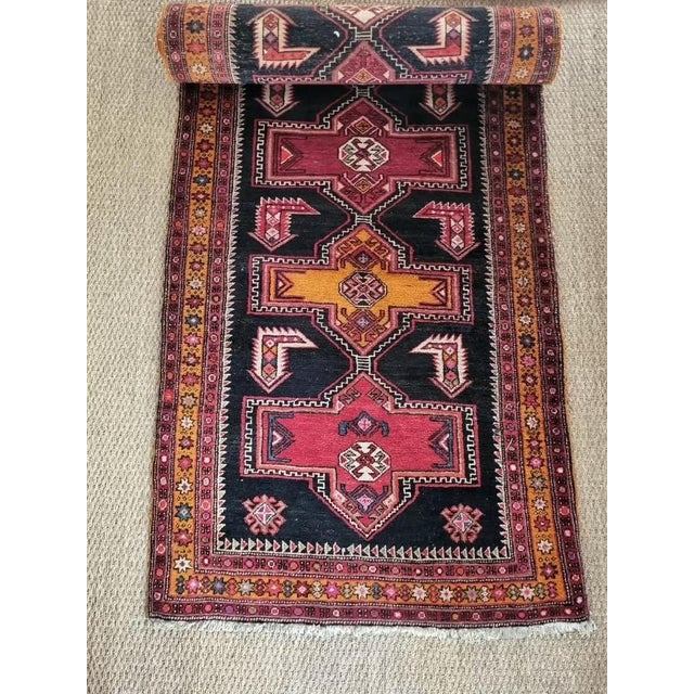 Hand-woven Iranian wool rug, ideal for a hallway.