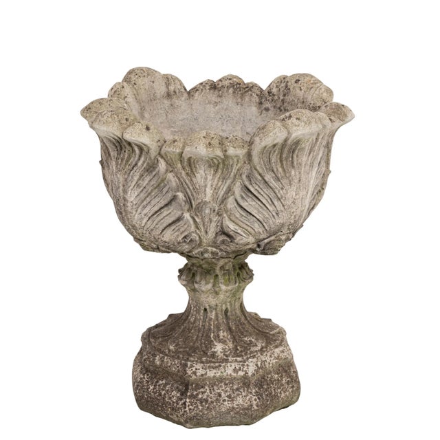 Beautifully designed cast stone acanthus leaf planters on stands. Some patina and in good condition.