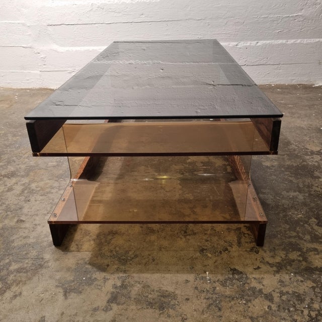 Beautiful Space Age coffee table Roche Bobois style with a tanned acrylic glass base and a bronze or it it dark green...
