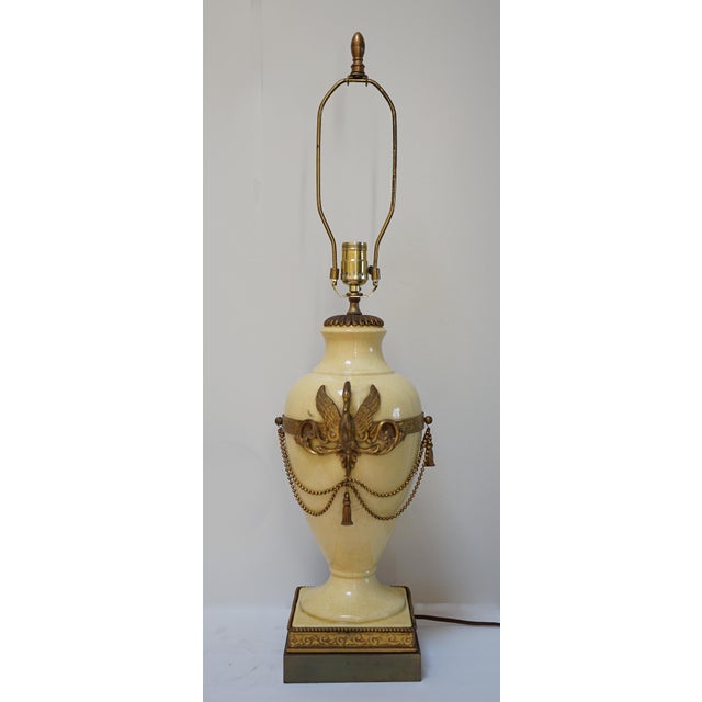 The color and the elegance of this French Empire, Neoclassical style lamp in yellow with a swan makes it a standout. It is...