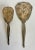 Here is a charming set of silver (tone or plated) hand-held vanity mirror and hairbrush. The back of the pieces has a...