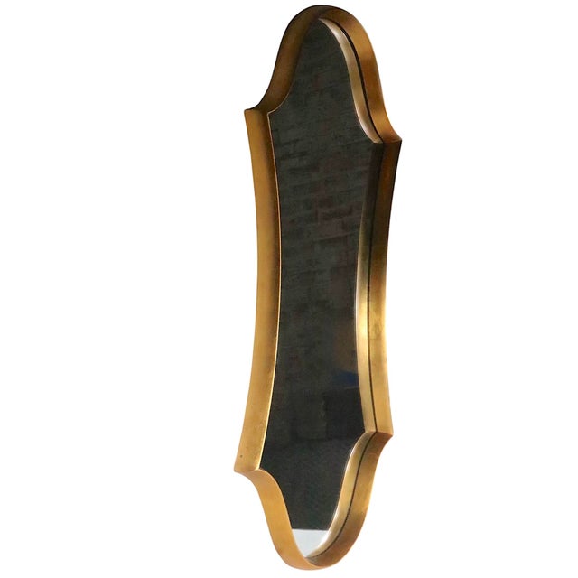 Voguish stylized Hollywood Regency wall mirror, attributed to Labarge. The mirror features a faux wood ( plastic ) gilt...