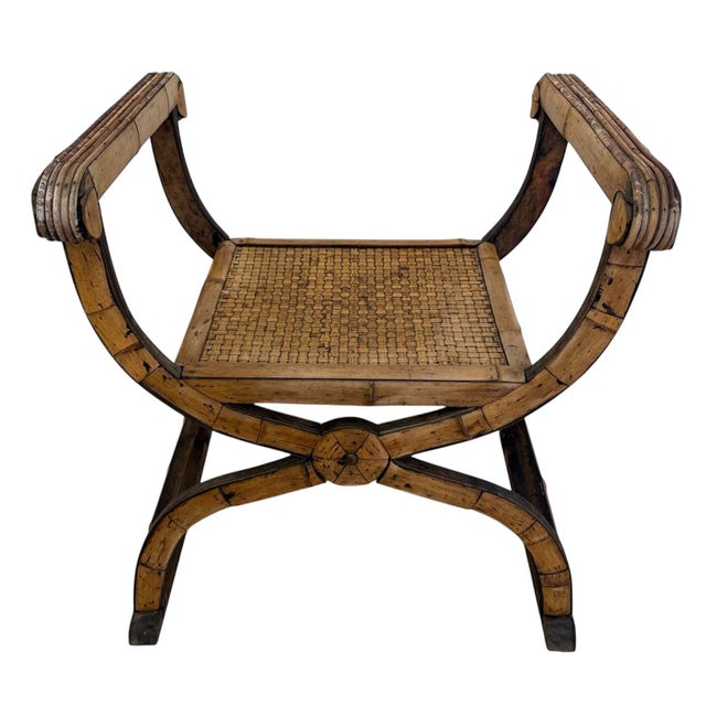 Vintage Savonarola style bench. Woven rattan seat. Finely Carved legs. Split reed arms. Bamboo sides to arms and legs....