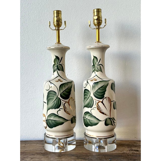 This elegant pair of vintage table lamps beautifully marries traditional botanical motifs with a touch of sophisticated...