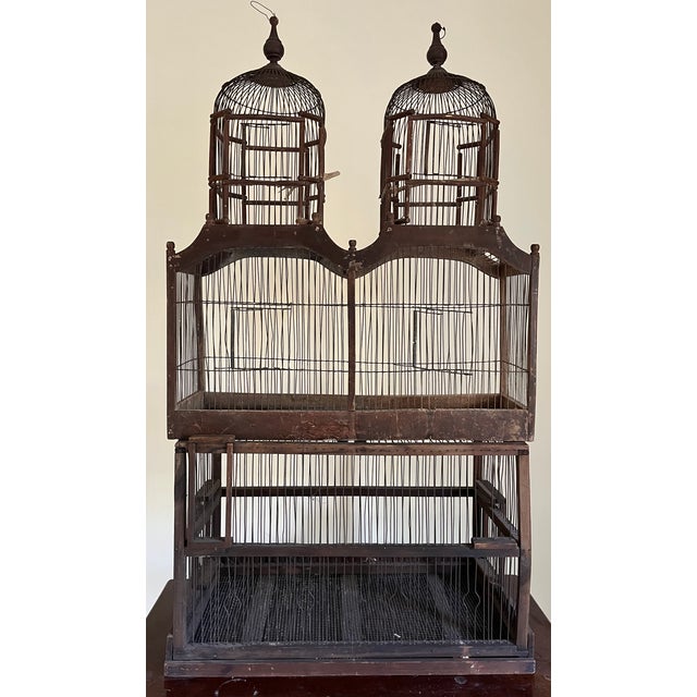 Large antique early 20th century French wood and wire turreted bird cage. Two parts with rectangular cage at the base....