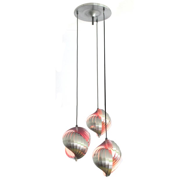 Vintage cascade pendant light from the 1970s, Lyfa Denmark. Each light is crafted with interlocking stainless steel...