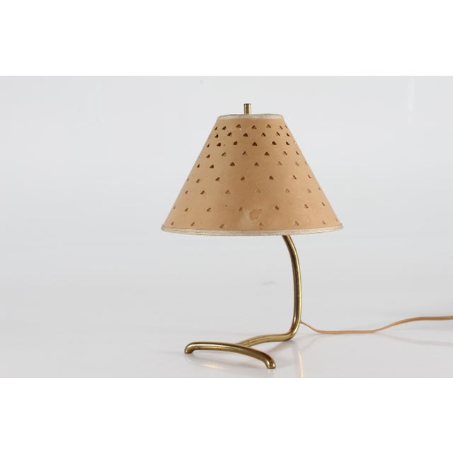 Small vintage table lamp made in Denmark in the 1940s. in the style of Paavo Tynell The lamp base is made of brass with...