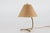 Small vintage table lamp made in Denmark in the 1940s. in the style of Paavo Tynell The lamp base is made of brass with...