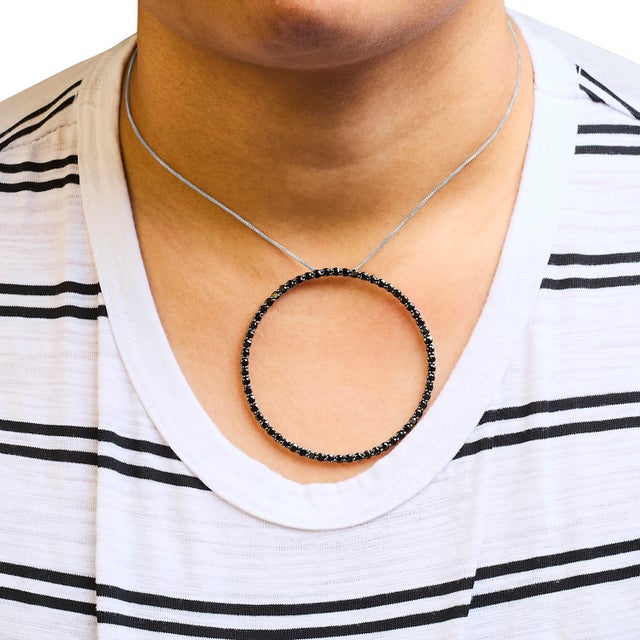 Experience the captivating allure of this stunning open hoop pendant necklace, designed to make a bold statement. Crafted...