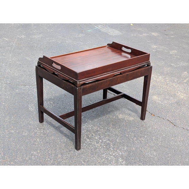 Exude timeless Victorian elegance with this exquisite late 19th-century antique English mahogany butler’s tray top table....