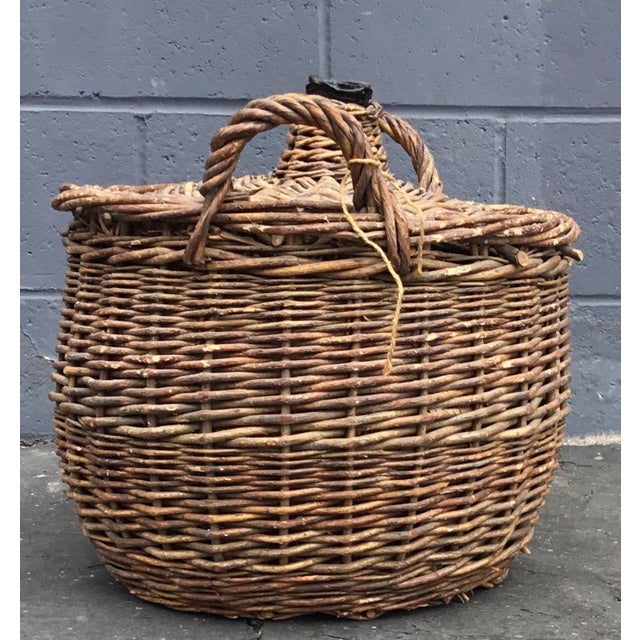 19th c. French vintner hand woven basket and glass from Provence. Wicker and glass Demi jar.