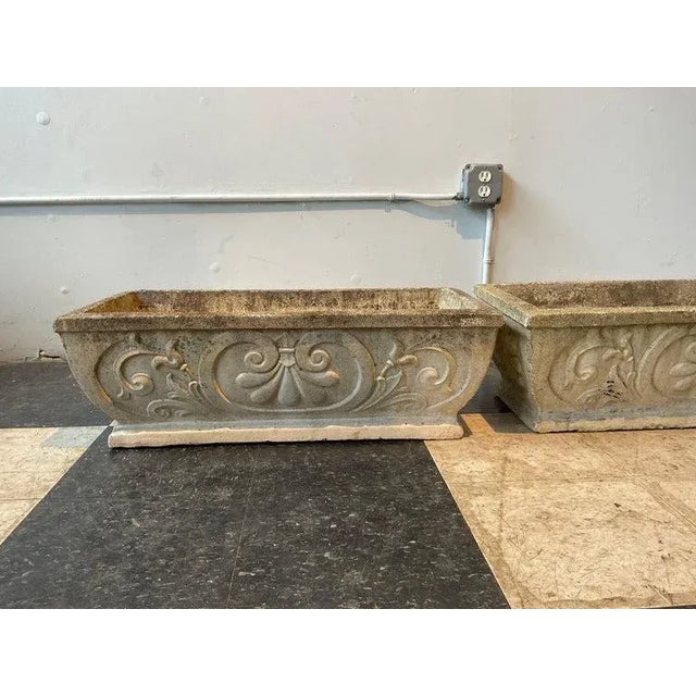 A pair of 1950s concrete planters. There are 4 pairs available. The price is 975 per pair.