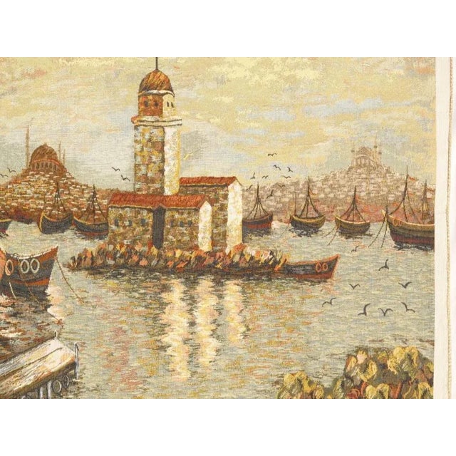 Flemish wall tapestry was woven on a large scale from wool with muted earth tones into a lavish landscape composition that...