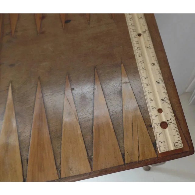 French fruitwood small table with cabriole legs ending in hoof foot, inlaid game board top and one drawer. Early 19th...