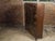 A wooden bow front vitrine cabinet attributed to Barbara Barry for Henredon from the late 20th century with oval motifs,...