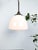 : Beautiful early Dutch opaline pendant lights by Philips. Constructed out of glass with unusual brass fixtures....