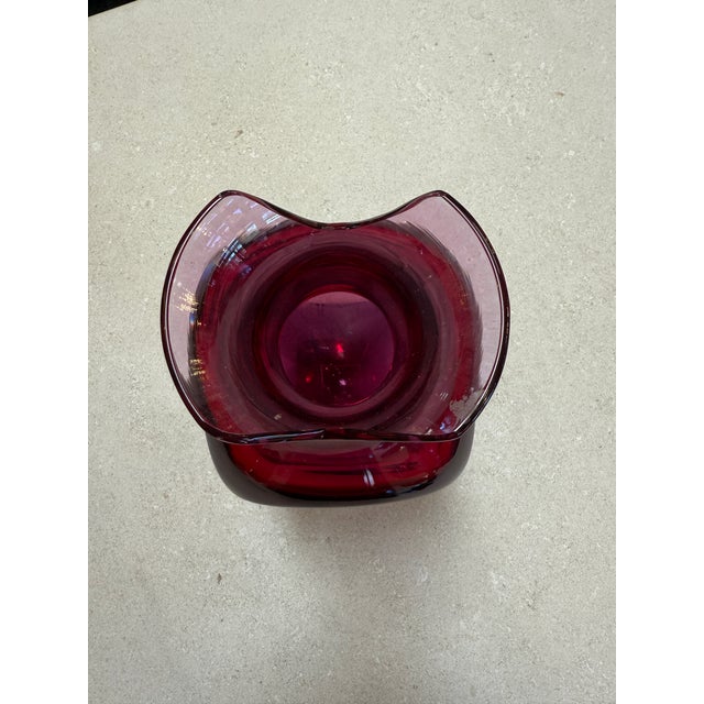 Elegant Murano glass vase executed in the sommerso technique by Flavio Poli for Seguso. The piece features a vibrant ruby-...