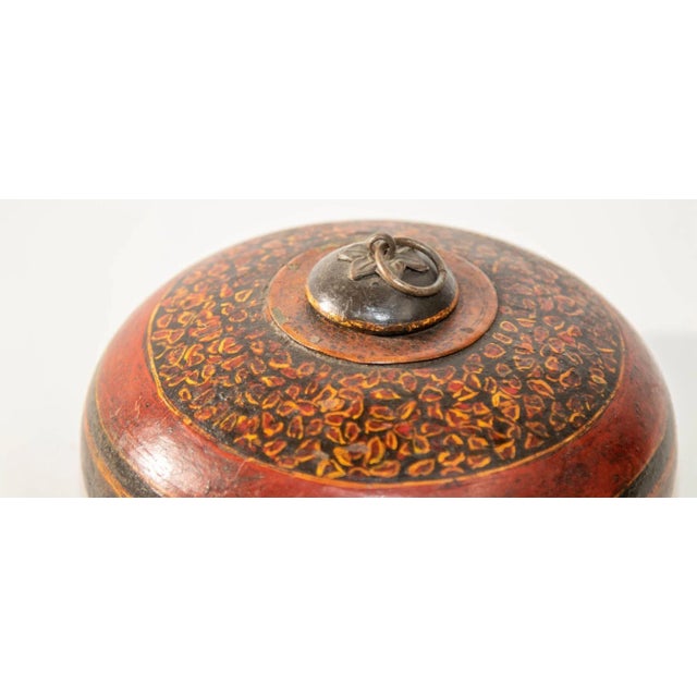 Vintage Asian Red and Black Painted Wooden Round Lidded Box with Metal Ring Handle. A distinctive vintage Asian round...