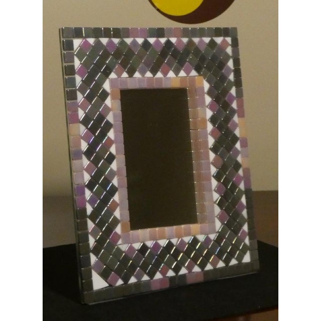 Restoration of a table mirror with the possibility of also being used as a photo frame. On the back of the base there are...