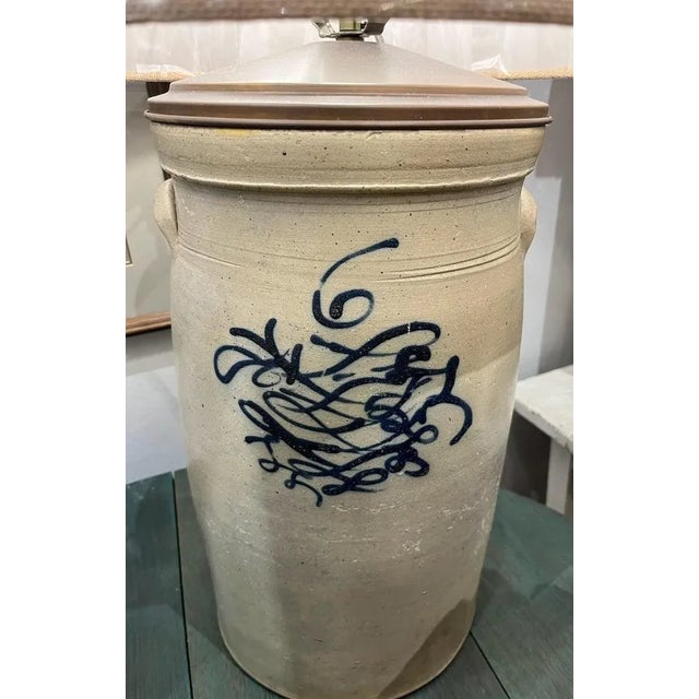 This fine 19thc decorated (butter churn ) crock with handles is in fine condition.It is newly wired and newly made linen...