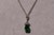 The 69th Street: Chrome Diopside and Diamond Necklace in White Gold.This necklace highlights a striking central pear...