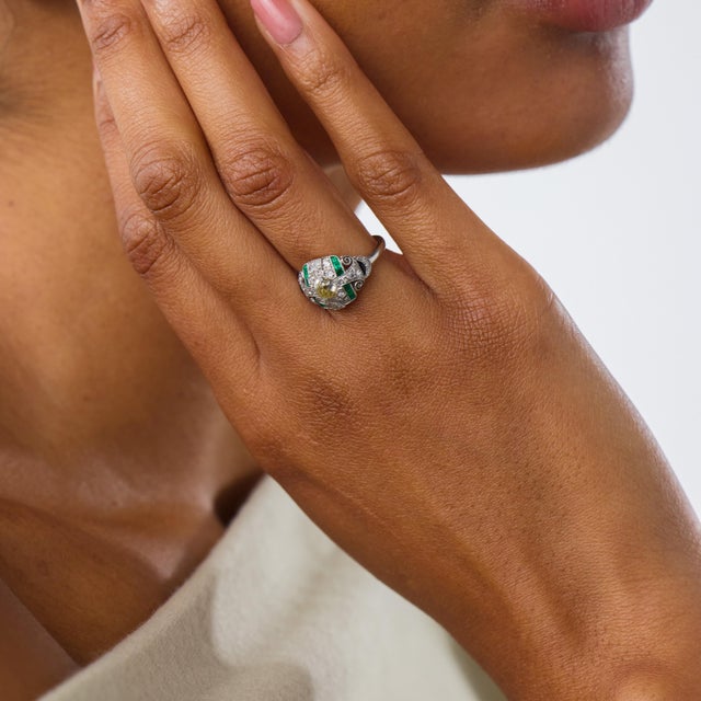 This captivating Art Deco ring is a beautifully geometric jewel from the 1930’s, centered by an old European cut diamond...