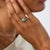 This captivating Art Deco ring is a beautifully geometric jewel from the 1930’s, centered by an old European cut diamond...