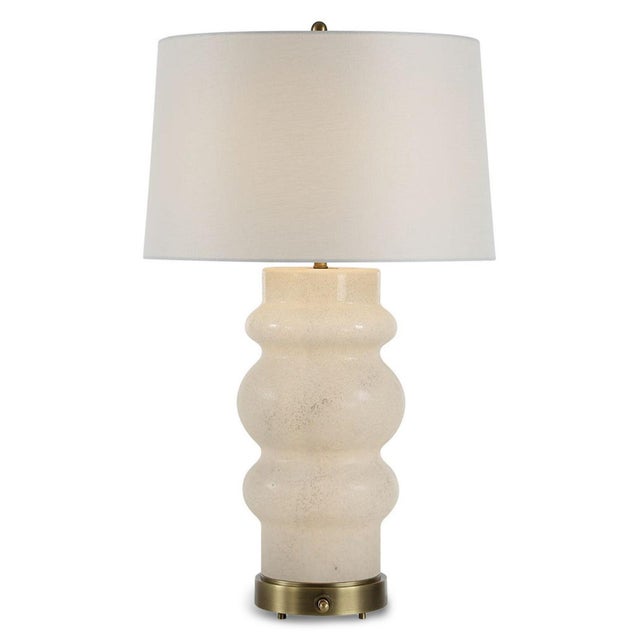 This elegant lamp features a sculptural body crafted from sandblasted alabaster glass, creating a softly textured and...