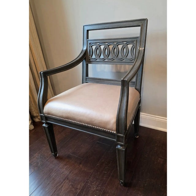 Set of 6 custom dining arm chairs in a beautiful slate gray finished frame, upholstered in a camel color leather and...