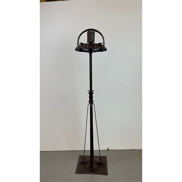 Elegant arts & crafts standing ashtray handcrafted in hammered wrought iron with a rich dark patina. Designed by hugo...