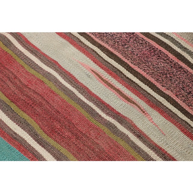 Made with handwoven wool in Persia circa 1950-1960, this 6x10 vintage Shahsavan Kilim is a particularly bright and sought-...